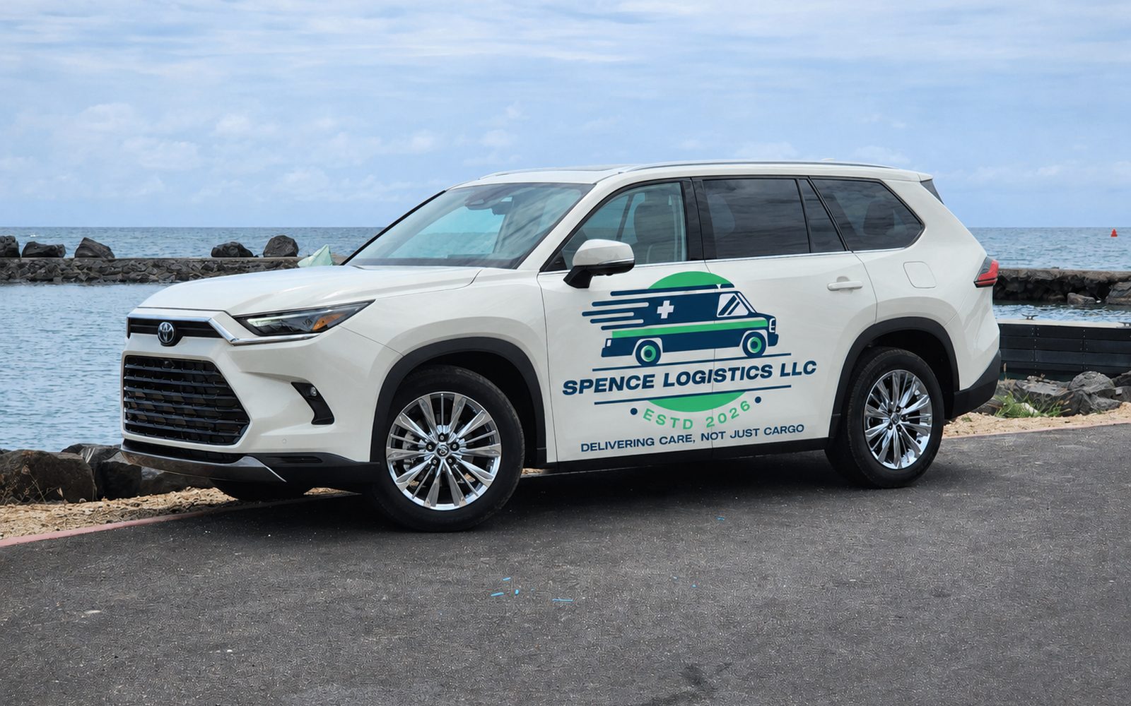 Spence Logistics LLC service vehicle, a white SUV with the company logo and the line Delivering Care, Not Just Cargo on the door.